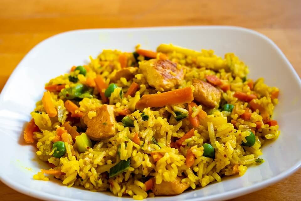 A plate of arroz con pollo, chicken with rice