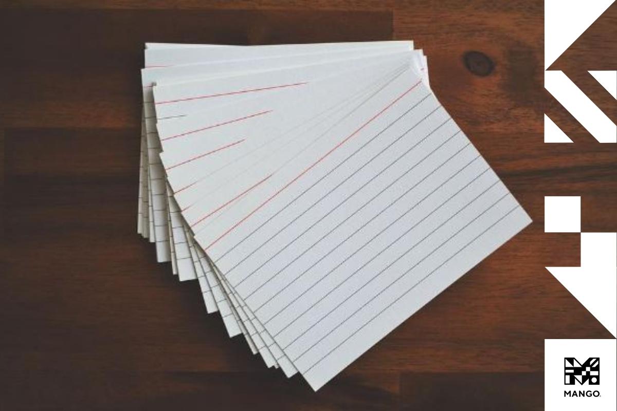 A pile of flashcards sitting on a desk