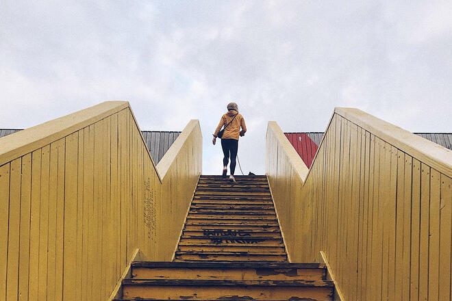 A girl climbing a flight of stairs