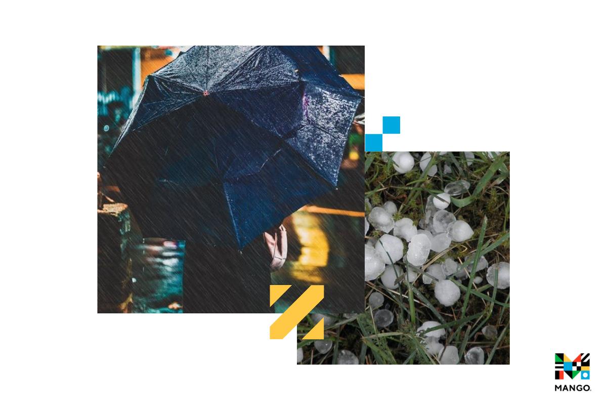 A person holding an umbrella and hail in grass