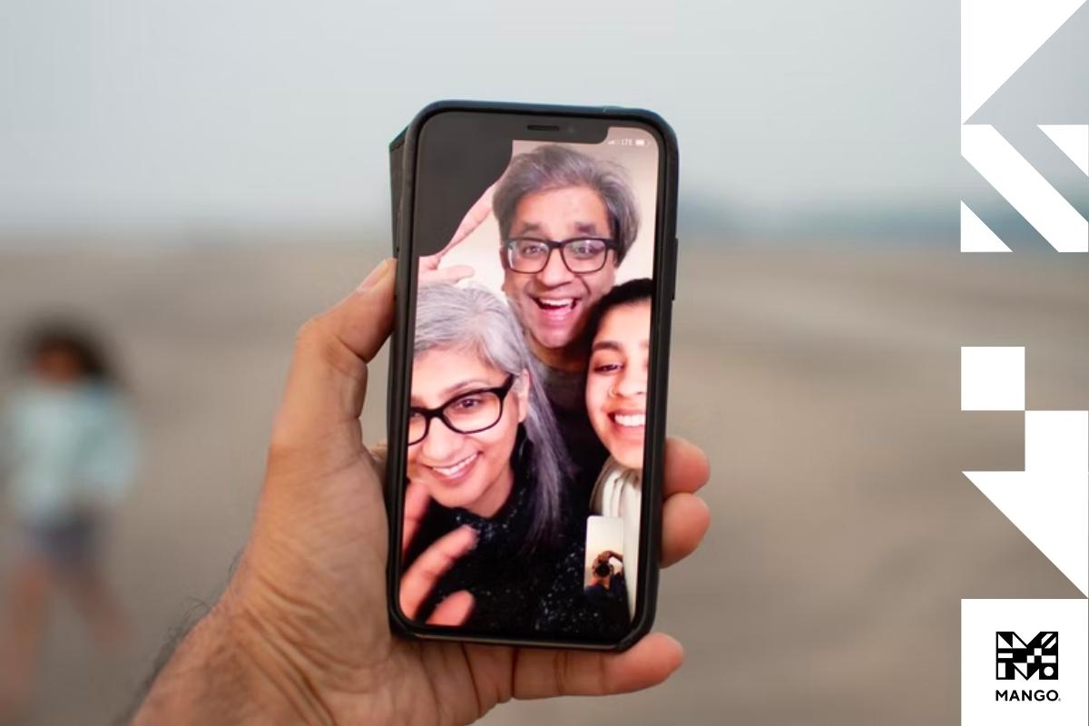 A person video-chatting their family on their smartphone