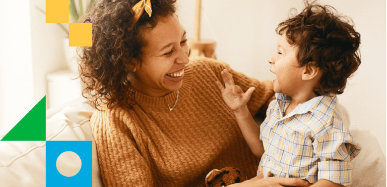 A mom playing and laughing with her son