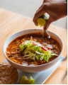 A bowl of pozole, a typical Mexican stew